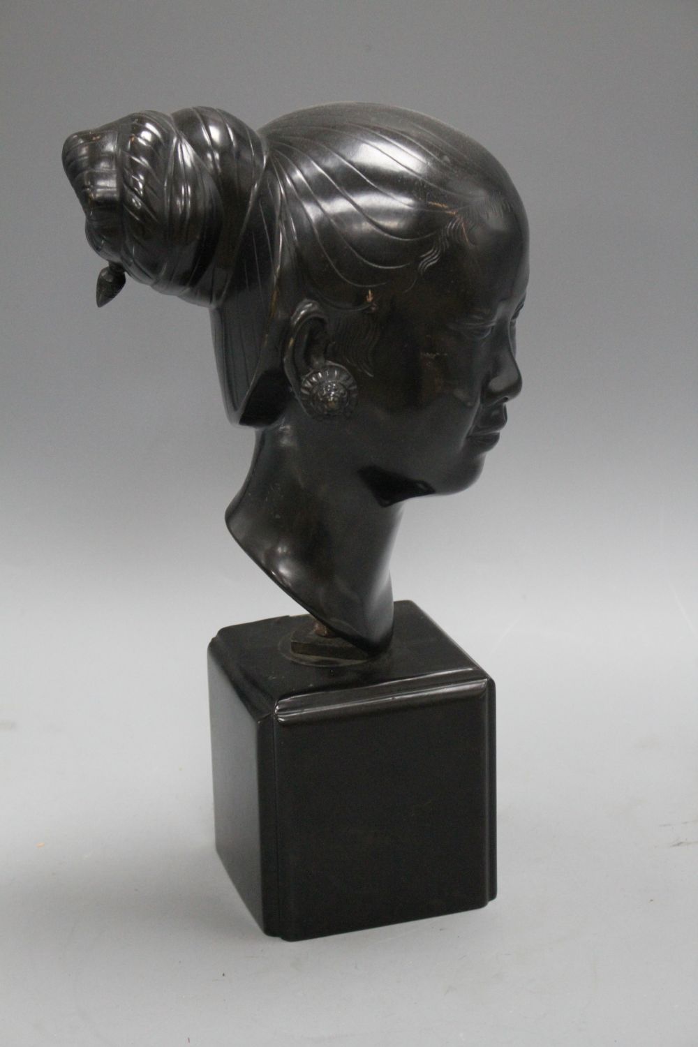 Nguyen Thanh Le (1919- Vietnam). A bronze head of a Vietnamese woman, H.13.5in.